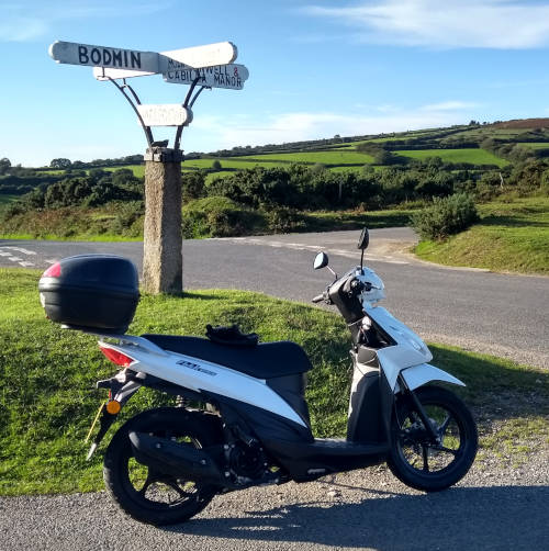The tiny white scooter